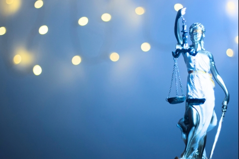 Stature of Justice with lights